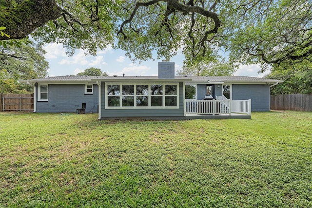 3917 N 31st St, Waco, TX 76708 - rear view of house with a chimney, brick siding, and a wooden deck