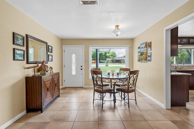 3917 N 31st St, Waco, TX 76708 - dining area featuring light tile patterned floors and baseboards