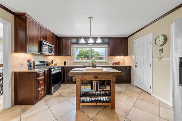 3917 N 31st St, Waco, TX 76708 - kitchen featuring stainless steel appliances, backsplash, dark brown cabinets, a sink, and light tile patterned floors