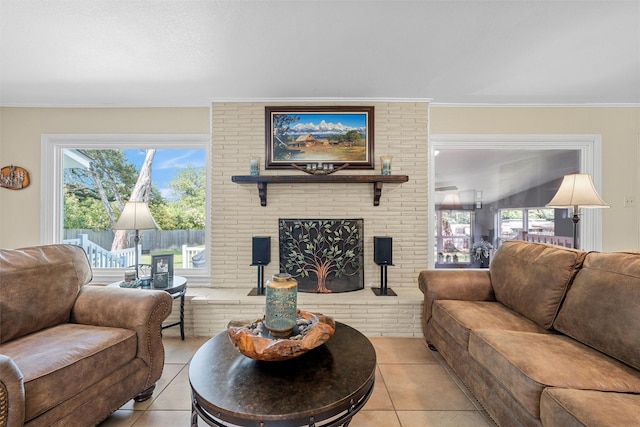 3917 N 31st St, Waco, TX 76708 - living room featuring light tile patterned floors, a brick fireplace, ornamental molding, and healthy amount of natural light