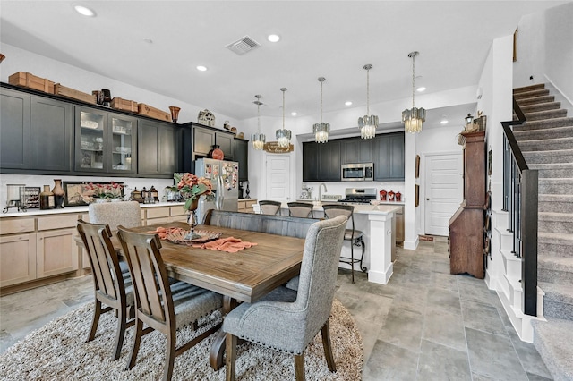 1134 Morgan Dr, Sherman, TX 75090 - dining space featuring stairs, recessed lighting, and light stone finish flooring