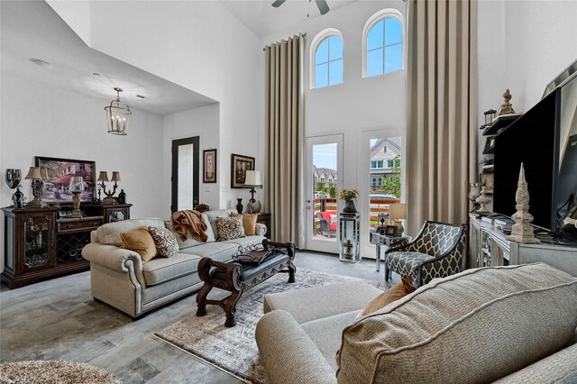 1134 Morgan Dr, Sherman, TX 75090 - living area featuring a high ceiling, ceiling fan, wood finished floors, and a chandelier