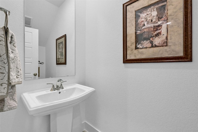 1134 Morgan Dr, Sherman, TX 75090 - bathroom with a sink and a textured wall
