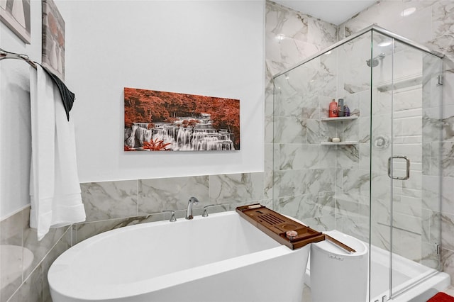 1134 Morgan Dr, Sherman, TX 75090 - full bathroom with a soaking tub, a shower stall, toilet, and tile walls