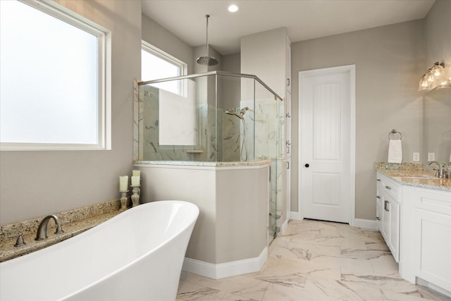 2141 Vanderbilt Dr, Weatherford, TX 76088 - full bathroom with a marble finish shower, a freestanding tub, marble finish flooring, vanity, and baseboards