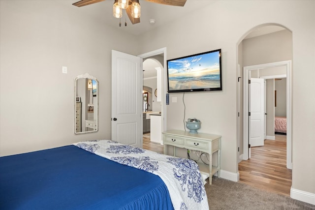 2141 Vanderbilt Dr, Weatherford, TX 76088 - carpeted bedroom featuring arched walkways, baseboards, and ceiling fan