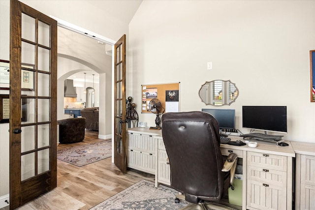 2141 Vanderbilt Dr, Weatherford, TX 76088 - office area featuring arched walkways, light wood-type flooring, lofted ceiling, and french doors