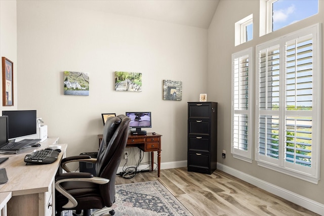 2141 Vanderbilt Dr, Weatherford, TX 76088 - office with plenty of natural light, light wood-style floors, baseboards, and vaulted ceiling