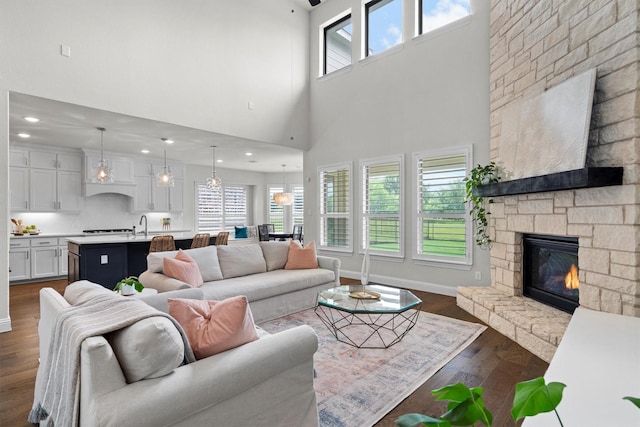 1112 Armadillo Trl, Argyle, TX 76226 - living area featuring a fireplace, dark wood finished floors, and a towering ceiling