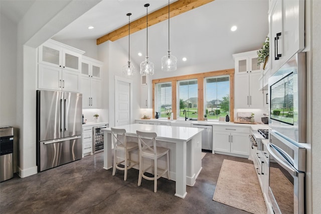 450 Cobb Ln, Waxahachie, TX 75167 - kitchen featuring appliances with stainless steel finishes, wine cooler, concrete floors, a center island, and recessed lighting