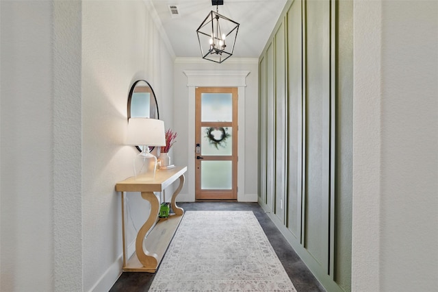 450 Cobb Ln, Waxahachie, TX 75167 - doorway with a chandelier, ornamental molding, baseboards, and a textured wall
