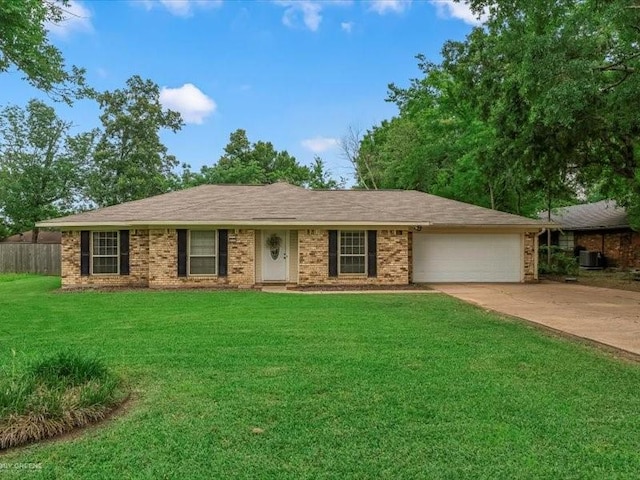 113 Park Blvd, Benton, LA 71006 - ranch-style house with a garage, concrete driveway, brick siding, and central AC