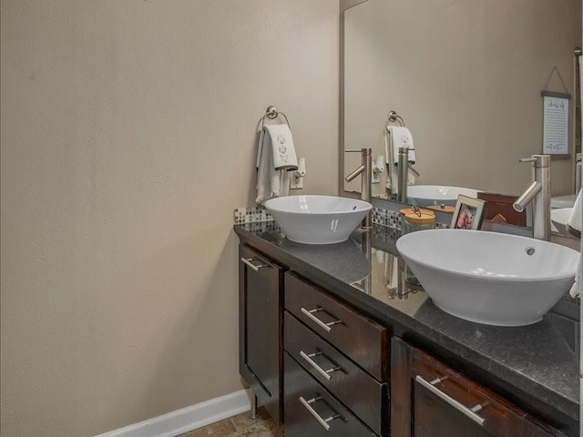 113 Park Blvd, Benton, LA 71006 - bathroom with double vanity and baseboards