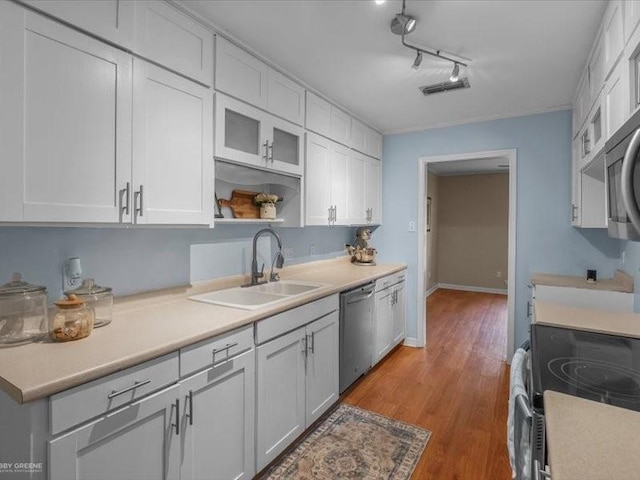 113 Park Blvd, Benton, LA 71006 - kitchen with stainless steel appliances, a sink, light countertops, and white cabinetry