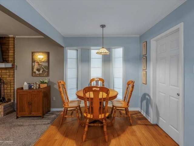 113 Park Blvd, Benton, LA 71006 - dining room featuring baseboards, crown molding, light wood-style floors, and a fireplace