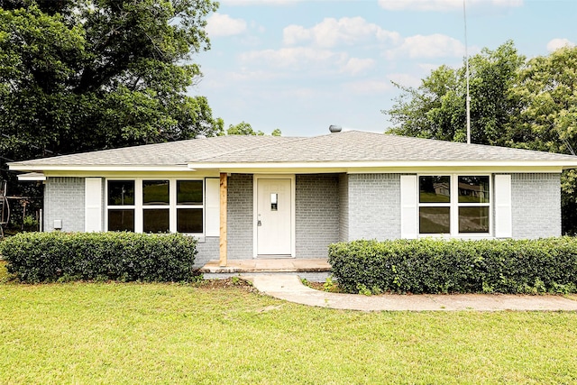 190 Trail Dr, Bowie, TX 76230 - ranch-style house with brick siding and a front yard