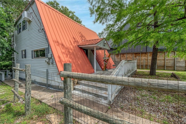195 Cambridge Dr, Pottsboro, TX 75076 - back of house featuring metal roof and a gambrel roof
