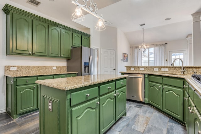 7200 Randall Way, Plano, TX 75025 - kitchen featuring appliances with stainless steel finishes, a kitchen island, a sink, a chandelier, and lofted ceiling