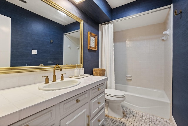 9402 Spring Hollow Dr, Dallas, TX 75243 - full bath with vanity, toilet, shower / bath combo with shower curtain, and tile patterned flooring