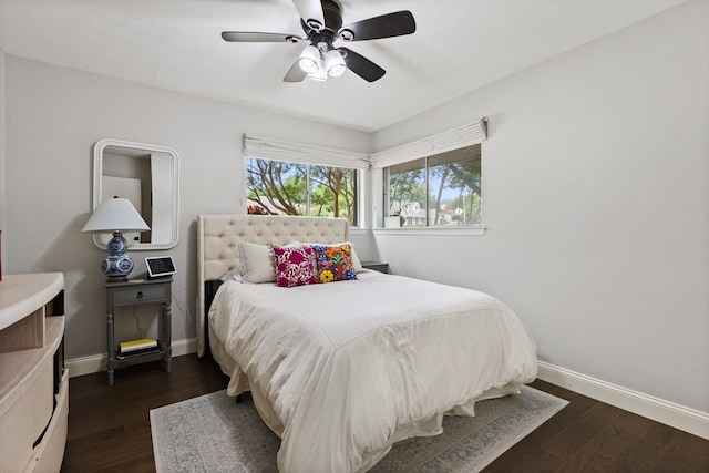 9402 Spring Hollow Dr, Dallas, TX 75243 - bedroom featuring baseboards, dark wood finished floors, and a ceiling fan