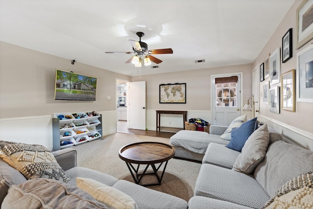 9402 Spring Hollow Dr, Dallas, TX 75243 - living area with wainscoting and ceiling fan