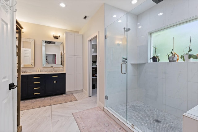 9402 Spring Hollow Dr, Dallas, TX 75243 - full bathroom with a stall shower, double vanity, marble look tiles, and recessed lighting