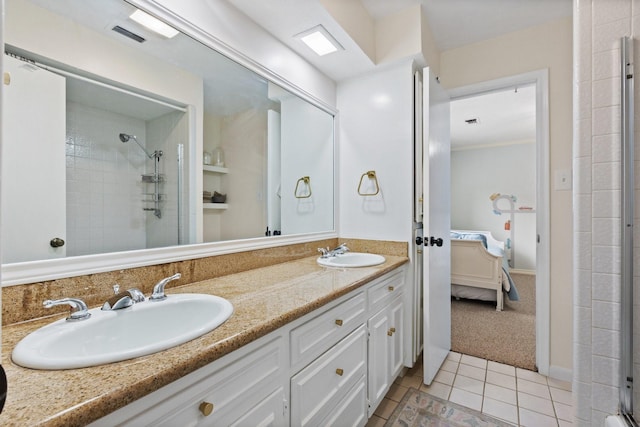9402 Spring Hollow Dr, Dallas, TX 75243 - ensuite bathroom featuring tile patterned flooring, tiled shower, and double vanity