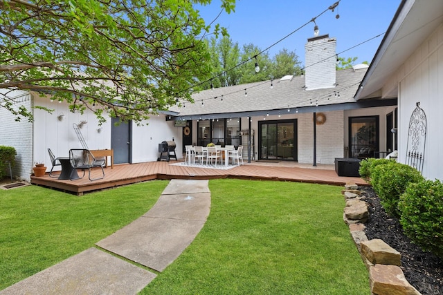 9402 Spring Hollow Dr, Dallas, TX 75243 - rear view of property with a wooden deck, brick siding, and a lawn