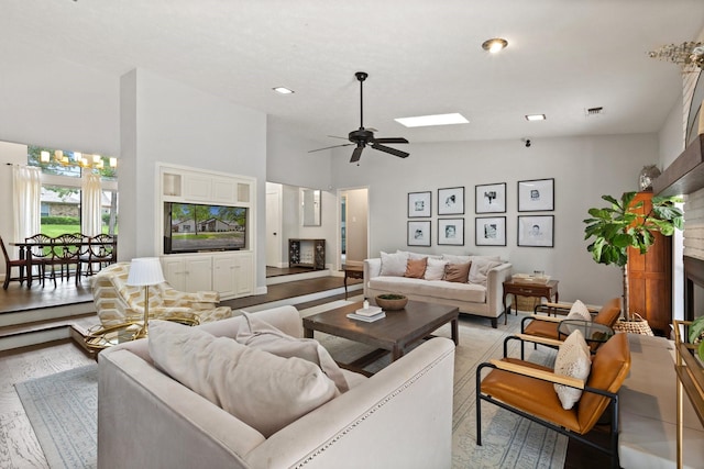 9402 Spring Hollow Dr, Dallas, TX 75243 - living area with a fireplace, ceiling fan, light wood-type flooring, and high vaulted ceiling