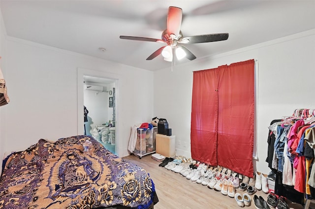 3950 Lisbon St, Fort Worth, TX 76107 - bedroom with wood finished floors, a wall mounted AC, and ceiling fan