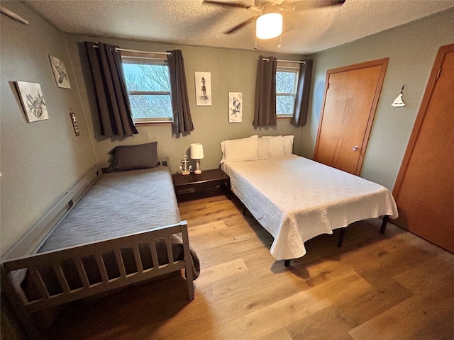 155 Saint Andrews Rd, Amarillo, TX 79118 - bedroom with light wood finished floors, a textured ceiling, and ceiling fan