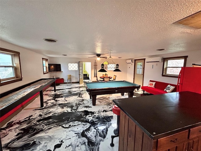 155 Saint Andrews Rd, Amarillo, TX 79118 - game room with billiards, a textured ceiling, plenty of natural light, and a wall mounted air conditioner