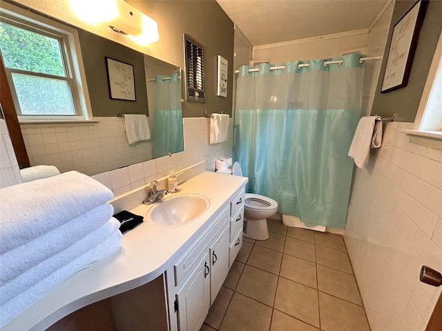 155 Saint Andrews Rd, Amarillo, TX 79118 - full bathroom with tile walls, tile patterned flooring, toilet, vanity, and a shower with shower curtain