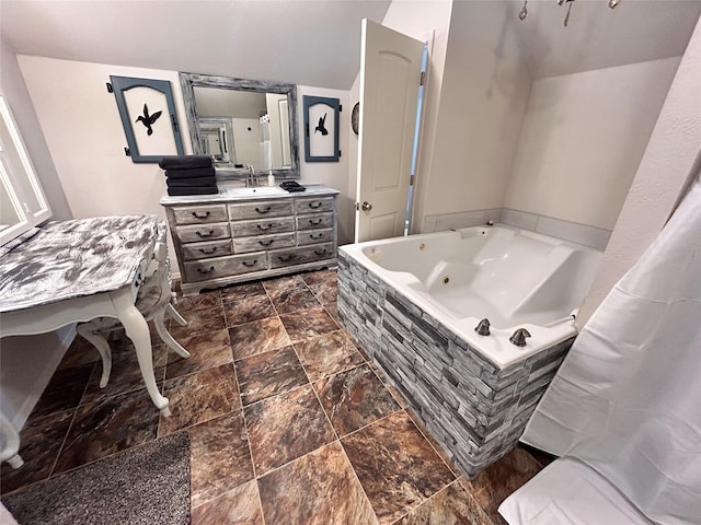 155 Saint Andrews Rd, Amarillo, TX 79118 - full bath with vanity, a jetted tub, and stone finish flooring