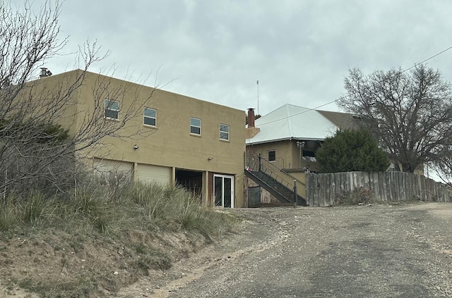 155 Saint Andrews Rd, Amarillo, TX 79118 - view of side of home with stairs and stucco siding