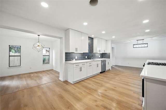 512 Shadowbrook Ln, Hurst, TX 76053 - kitchen with dishwasher, a sink, light countertops, light wood-style flooring, and backsplash