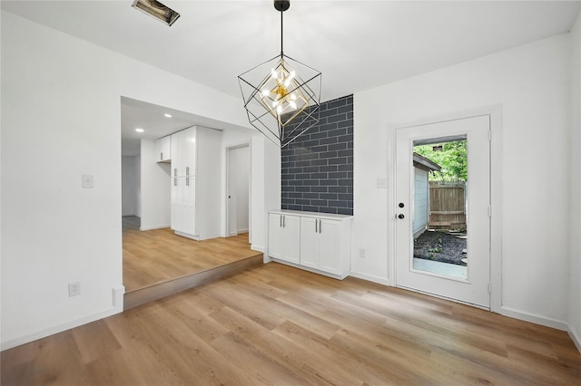 512 Shadowbrook Ln, Hurst, TX 76053 - unfurnished dining area featuring light wood-style floors, baseboards, a chandelier, and recessed lighting