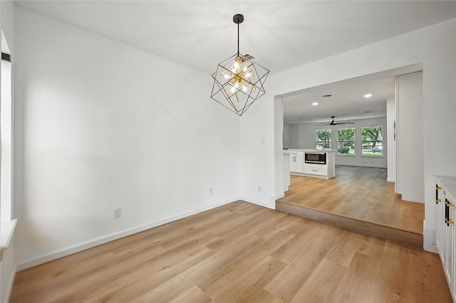512 Shadowbrook Ln, Hurst, TX 76053 - unfurnished dining area featuring light wood-style flooring, recessed lighting, baseboards, a chandelier, and a ceiling fan