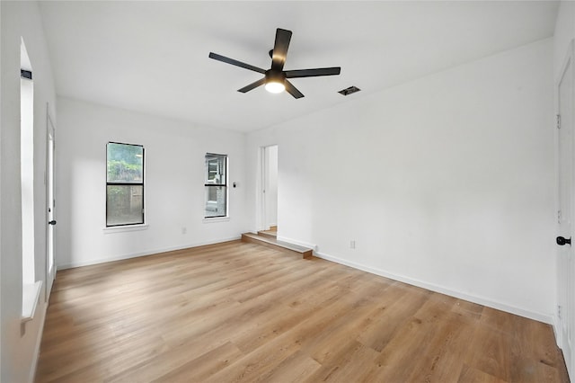 512 Shadowbrook Ln, Hurst, TX 76053 - spare room with ceiling fan, light wood-type flooring, and baseboards
