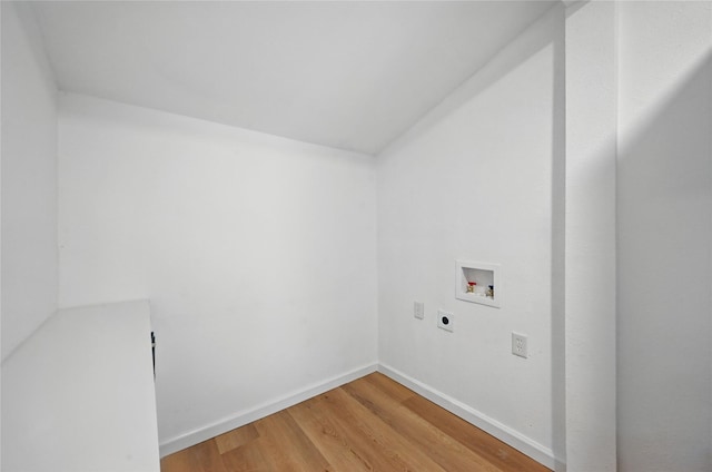 512 Shadowbrook Ln, Hurst, TX 76053 - washroom featuring electric dryer hookup, washer hookup, light wood-style flooring, and baseboards