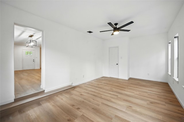 512 Shadowbrook Ln, Hurst, TX 76053 - unfurnished room featuring a ceiling fan, light wood-type flooring, and baseboards