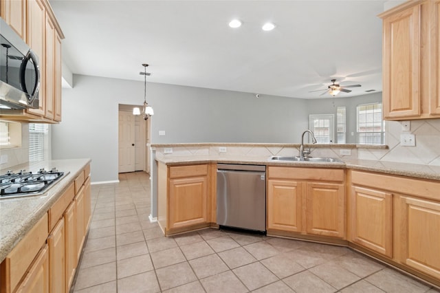 2125 Garden Crest Dr, Rockwall, TX 75087 - kitchen featuring appliances with stainless steel finishes, a sink, light brown cabinetry, ceiling fan, and tasteful backsplash