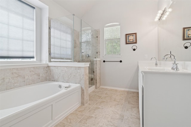 2125 Garden Crest Dr, Rockwall, TX 75087 - full bathroom with a bath, a shower stall, double vanity, and baseboards