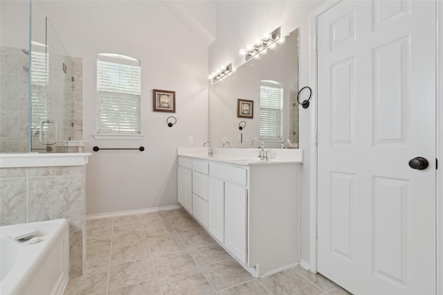 2125 Garden Crest Dr, Rockwall, TX 75087 - full bath with double vanity, a tile shower, a bath, lofted ceiling, and baseboards