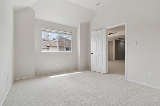 2125 Garden Crest Dr, Rockwall, TX 75087 - carpeted empty room with vaulted ceiling, baseboards, and a ceiling fan