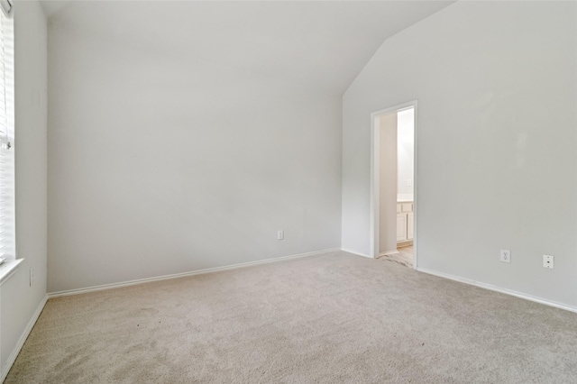 2125 Garden Crest Dr, Rockwall, TX 75087 - spare room with carpet flooring, lofted ceiling, and baseboards