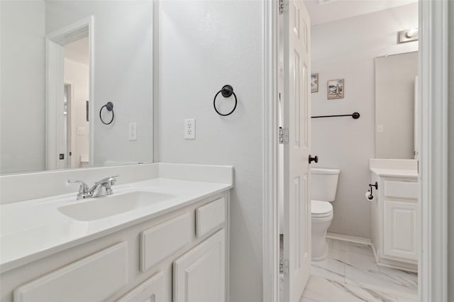 2125 Garden Crest Dr, Rockwall, TX 75087 - bathroom with toilet, marble look tile flooring, and vanity