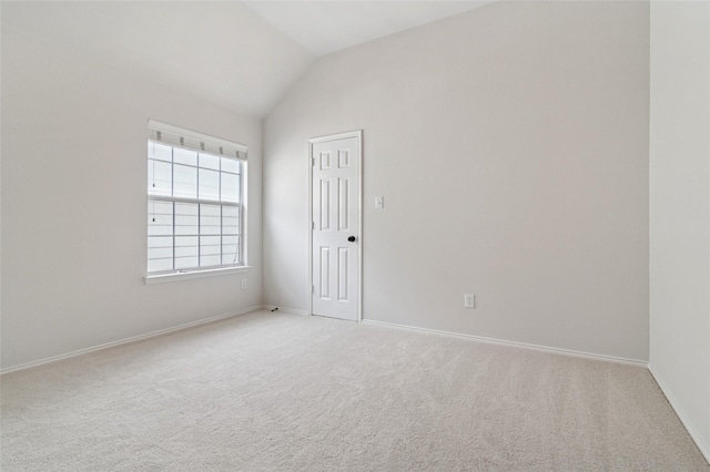 2125 Garden Crest Dr, Rockwall, TX 75087 - empty room with light colored carpet, lofted ceiling, and baseboards