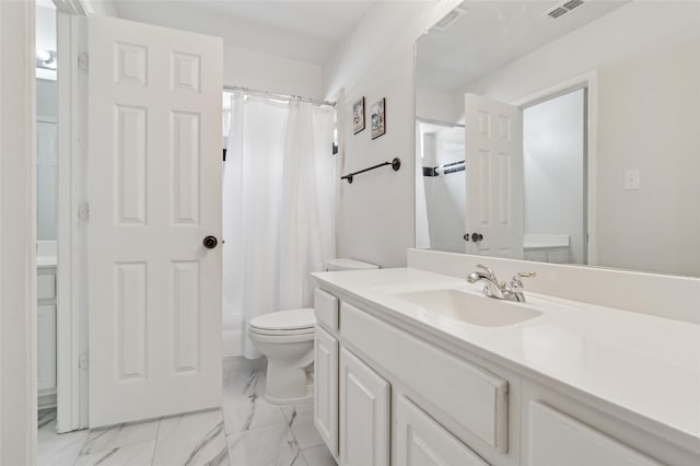 2125 Garden Crest Dr, Rockwall, TX 75087 - bathroom featuring vanity, toilet, and marble finish floors