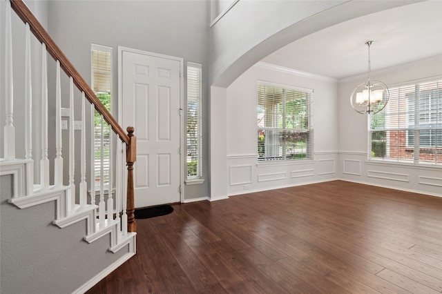 2125 Garden Crest Dr, Rockwall, TX 75087 - foyer featuring arched walkways, wood-type flooring, healthy amount of natural light, stairway, and ornamental molding